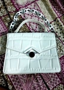 white hand purse