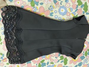 Chic Black Dress with Lace Hem