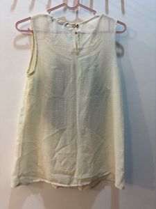 Formal Cream Sleeveless Top with Black Bow