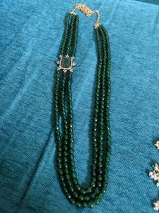 3 line Emerald chain with a locket.