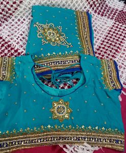 party wear saree firozi colour saree &amp; dark blue border with beautifu work as per showing in pic full length saree blouse size mention in pic