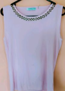 Pastel Pink Top. Bead work on the neck.  Small spo