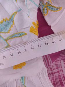 White Top With Yellow And Light Blue Embroidery