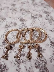 Golden Bangles with Dangling Charms