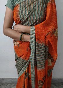 Elegant Orange Printed Saree with Floral and Geome