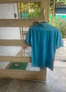 Brand New T Shirt Sky blue colour with red colour, print on right arm