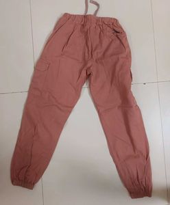a pink cargo style joggers.
