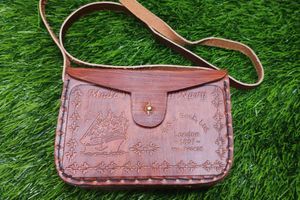 Binocular With A Leather Bag.