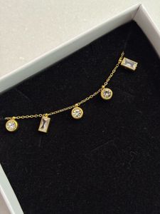 Gold Tone Crystal Charm Necklace