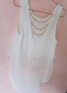 Styling White Top With Golden Back Chains