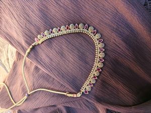 Elegant Gold-Tone Necklace with Red Accents