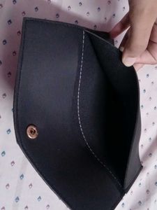 black clutch and guess watch