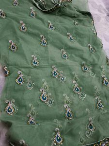 Heavy Party Wear With Stone Work Green Net Saree