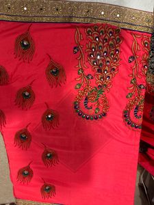 Elegant Pink Sari with Peacock Design