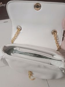 Brand New small sling with gold slin
