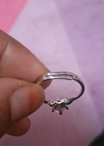 beautifull silver color ring, adjustable with intact stone..