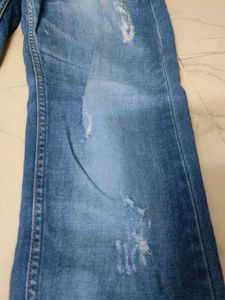 Distressed Blue Denim Jeans