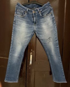 Distressed Denim Jeans