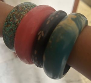 combo of wooden, golden and designer bangles