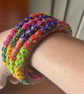 combo of wooden, golden and designer bangles