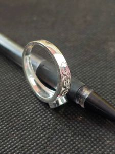 Pure silver ring with green zircon stone.