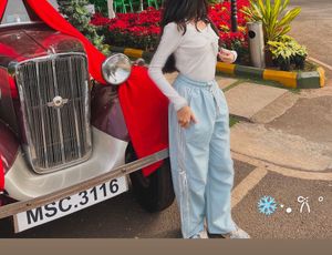 Trendy bowy white full sleeves top with a cut on s