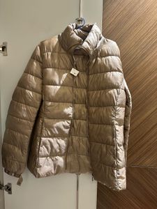 Light gold puffer jacket from Mango