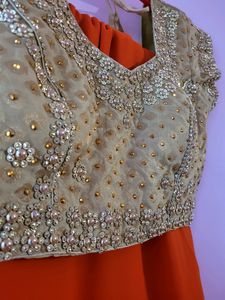 Orange Georgette Saree With 2  Worked Gold Blouse