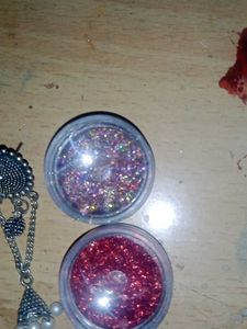 Elegant Jhumka Earrings and nail glitter