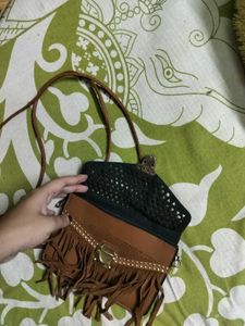 BROWN TASSLED SLING BAG