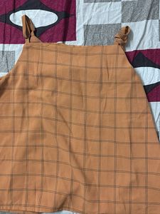 sleeveless checkered button-down top