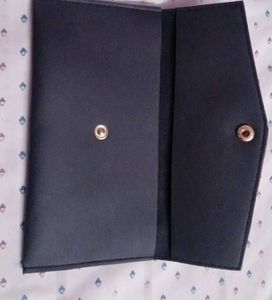 black clutch and guess watch