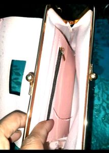 Pink kiss-lock coin purse