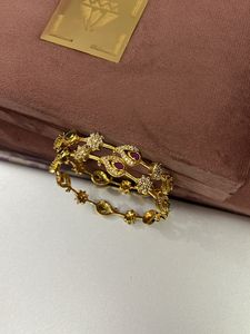 2.6 Gold Polish Set Of Two Bangles American Diamon
