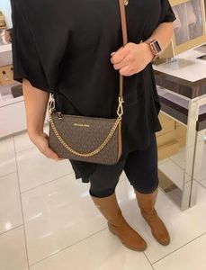 Michael Kors Clutch/ sling bags