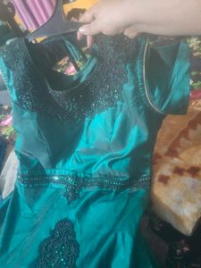 Party Wear Good Looking Gown In Rama Green Colour