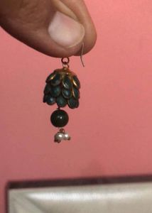 Green earrings Have Some Signs Of Wear And Tear