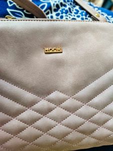 Pink Mochi Sling Bag With Quilted Front And Solid