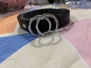 A black belt with silver buckle