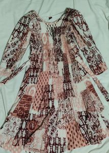 Frock with Peach and brown designs and a short frock its size 30