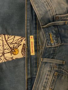 Distressed Light Wash Denim Jeans