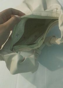 A Beige Side Bag.