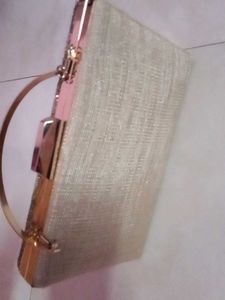 get this  embroidered branded cluch @499