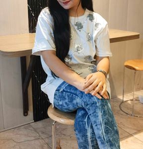 Ripped Blue Jeans With White Baggy Tshirt