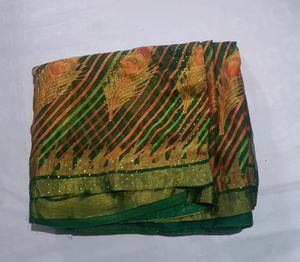 Green Saree With Orange Contrast Blouse