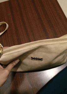 cream colour sling bag