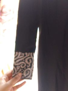 Black Skirt with Embroidered Hem