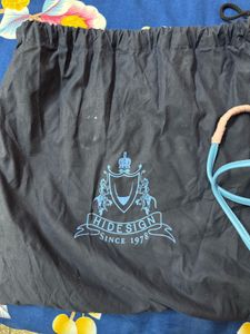 Hidesign sling with leather charm n dust bag