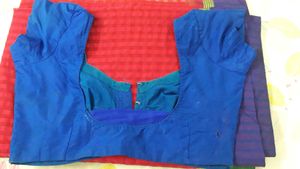Red colour saree with multi coloured boarders,  fe