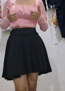 a black skirt with attached shorts inside
